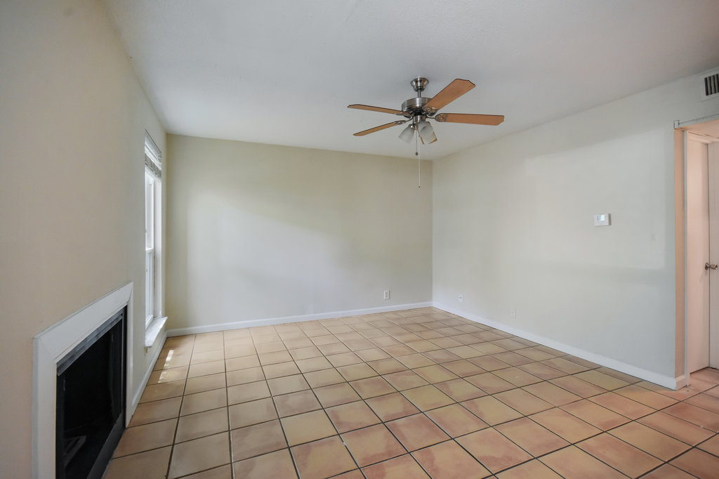 1000 West 26th Street, Unit 102 Austin, TX 78705 - Photo 7 of 23 a view of an empty room and chandelier fan