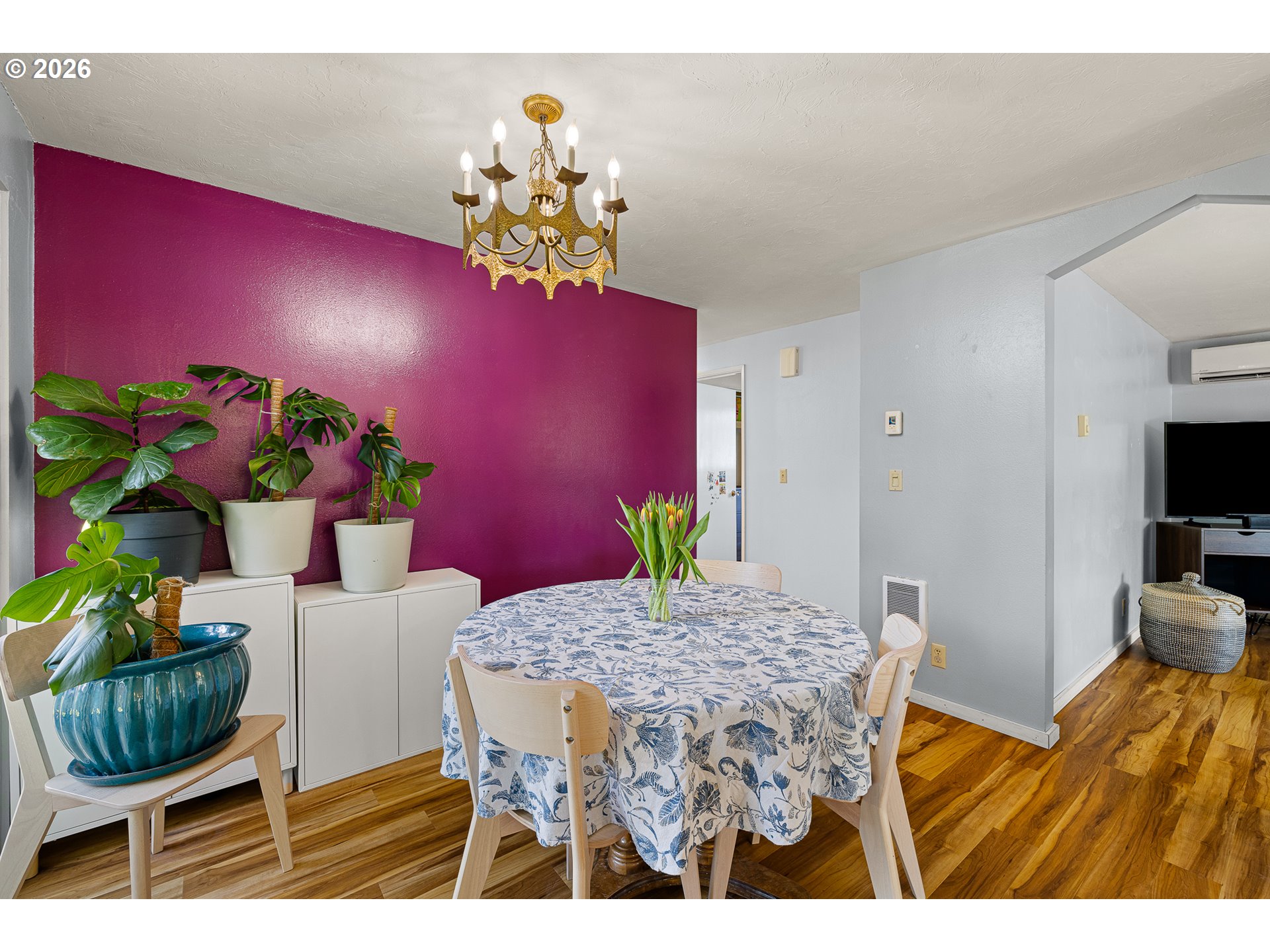 992 Candlelight Drive Eugene, OR 97402 - Photo 14 of 35 a view of a dining room with furniture and a potted plant