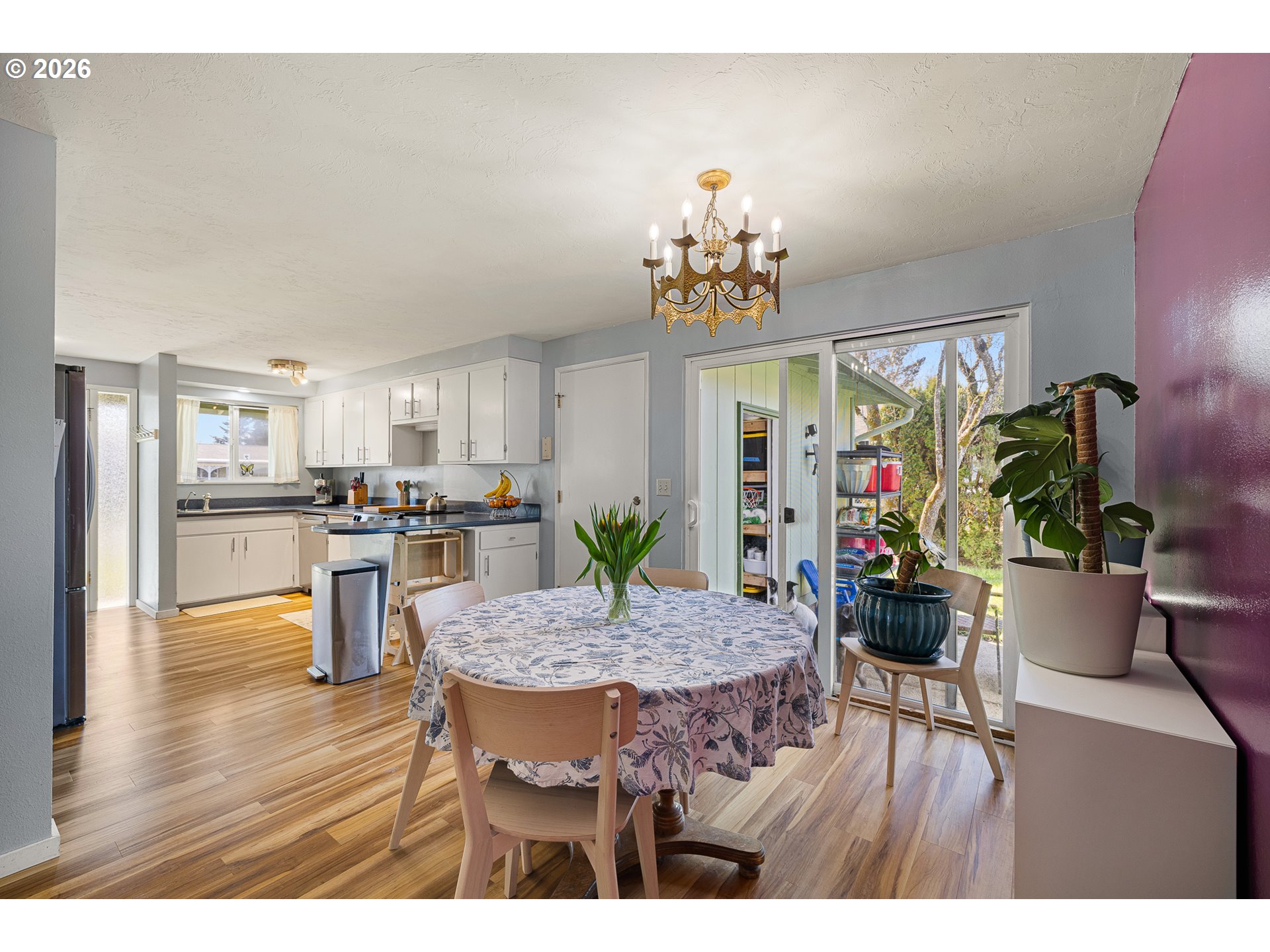 992 Candlelight Drive Eugene, OR 97402 - Photo 15 of 35 a view of a dining room with furniture and wooden floor