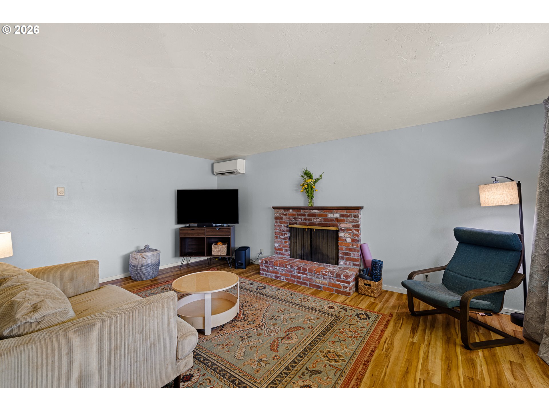992 Candlelight Drive Eugene, OR 97402 - Photo 16 of 35 a living room with furniture and a flat screen tv