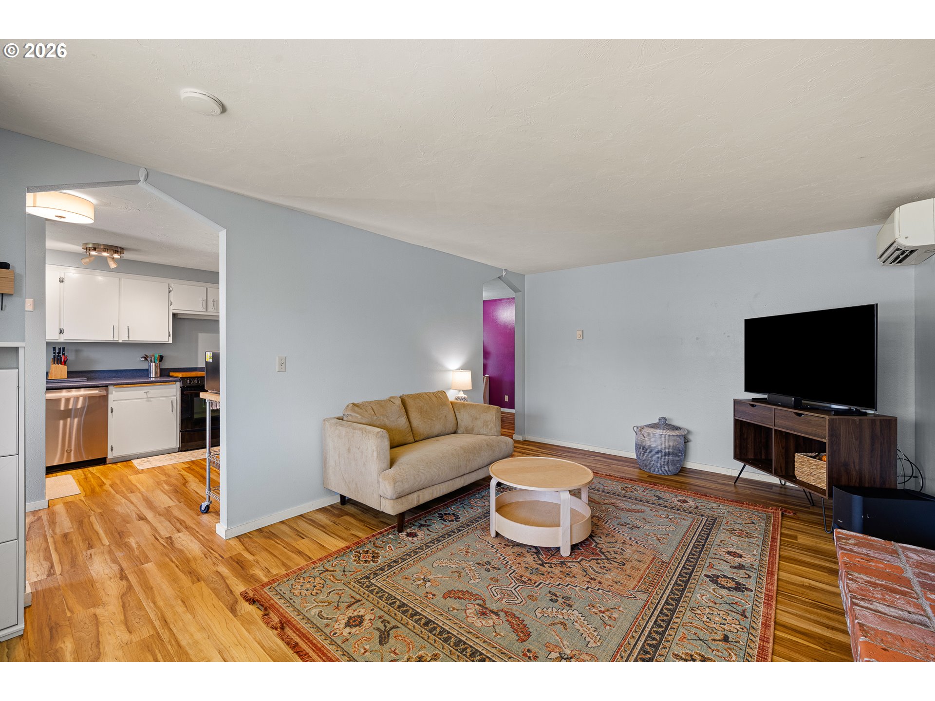 992 Candlelight Drive Eugene, OR 97402 - Photo 18 of 35 a living room with furniture and a flat screen tv