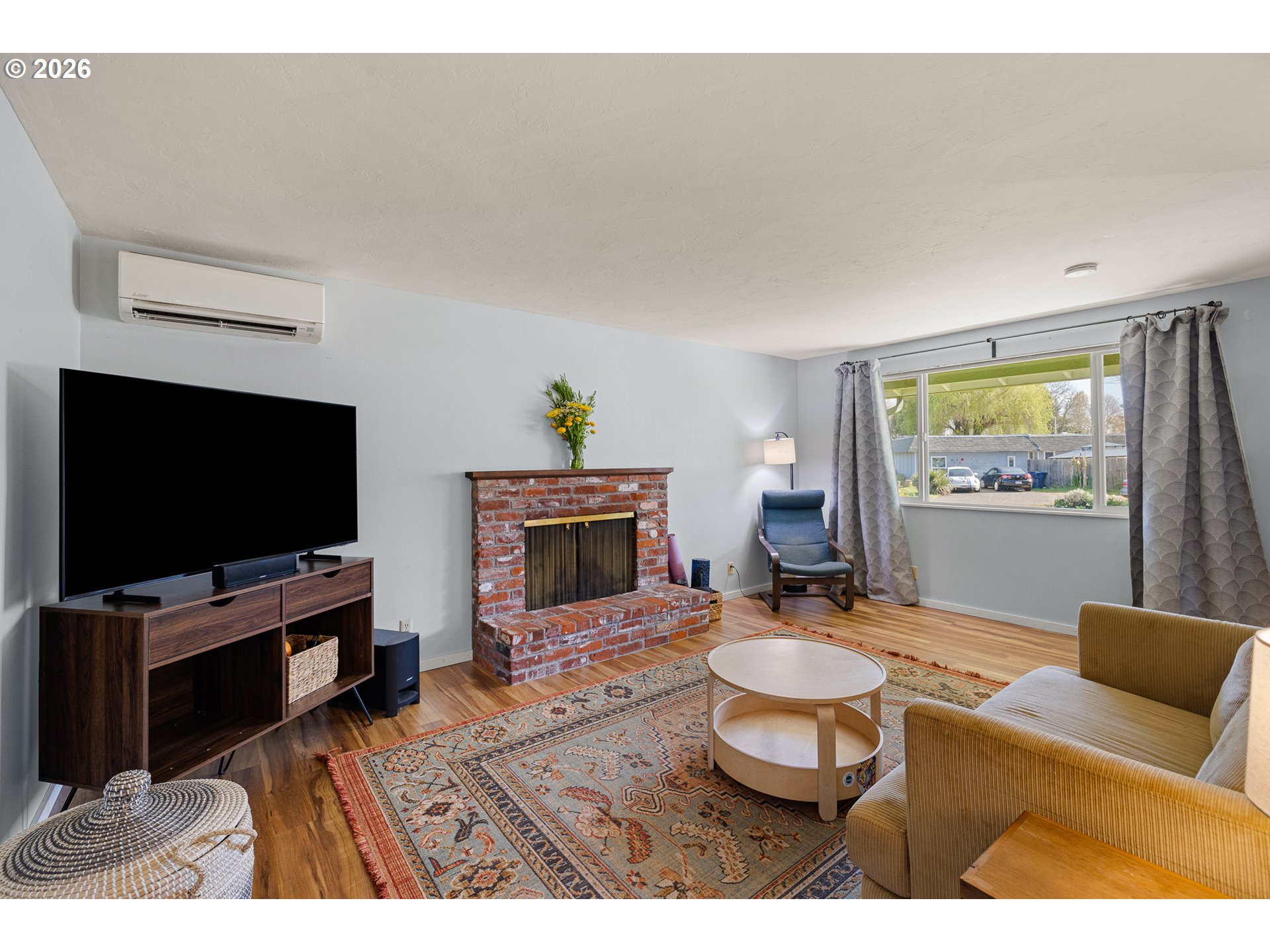 992 Candlelight Drive Eugene, OR 97402 - Photo 19 of 35 a living room with furniture and a flat screen tv