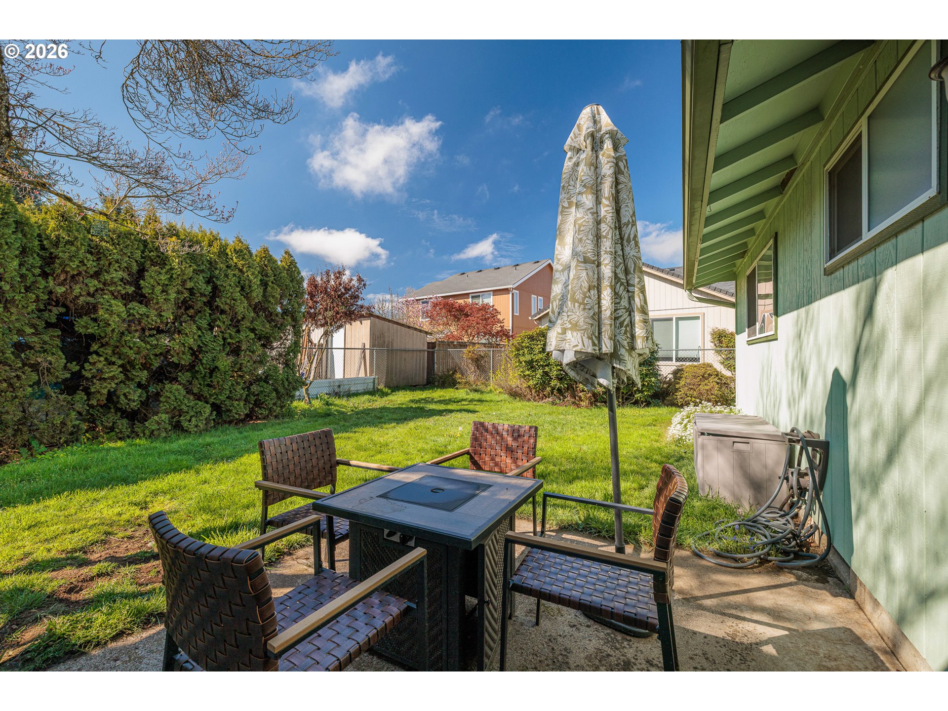 992 Candlelight Drive Eugene, OR 97402 - Photo 27 of 35 a view of outdoor dining space with a table and chairs