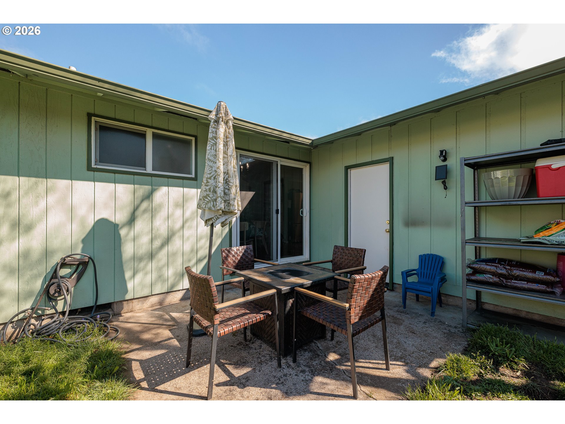 992 Candlelight Drive Eugene, OR 97402 - Photo 28 of 35 a backyard of a house with barbeque oven table and chairs