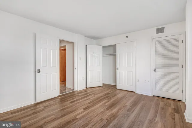 a view of a livingroom with wooden floor
