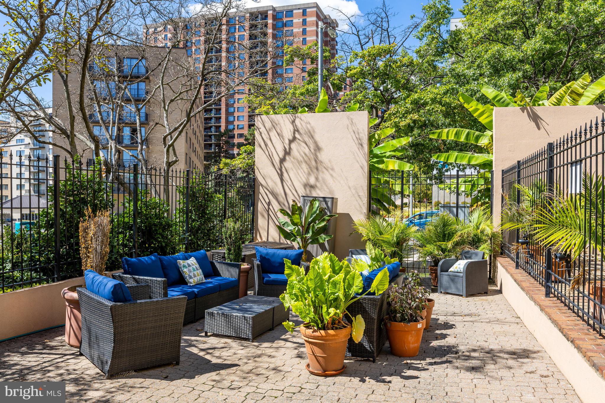 1301 North Courthouse Road, Unit 705 Arlington, VA 22201 - Photo 26 of 38 a view of a patio with plants and chairs