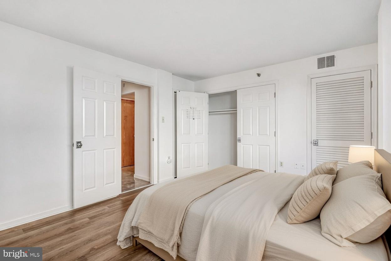 1301 North Courthouse Road, Unit 705 Arlington, VA 22201 - Photo 10 of 38 a bedroom with a bed and a closet