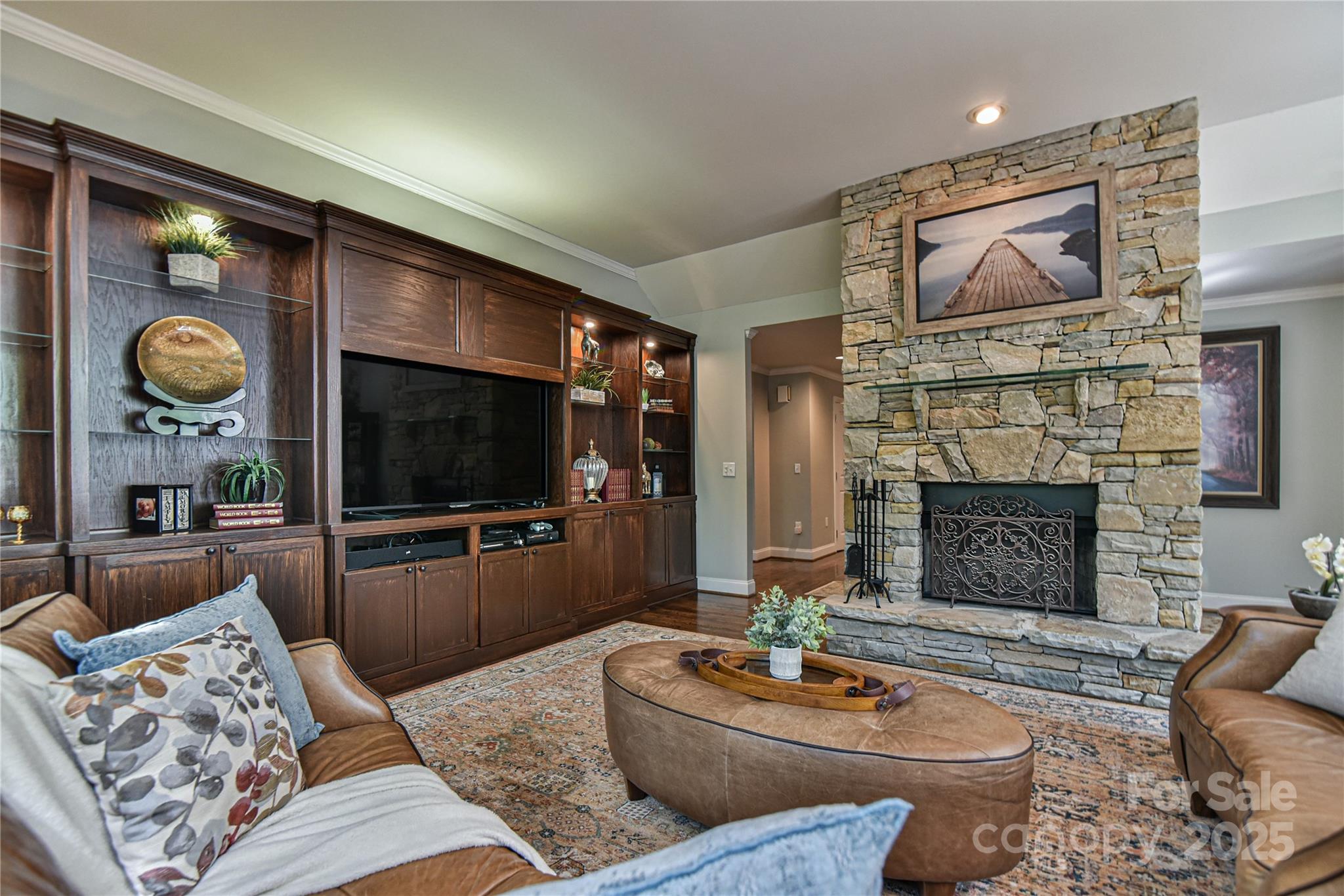 409 North Fork Road Black Mountain, NC 28711 - Photo 13 of 48 a living room with furniture a flat screen tv and a fireplace