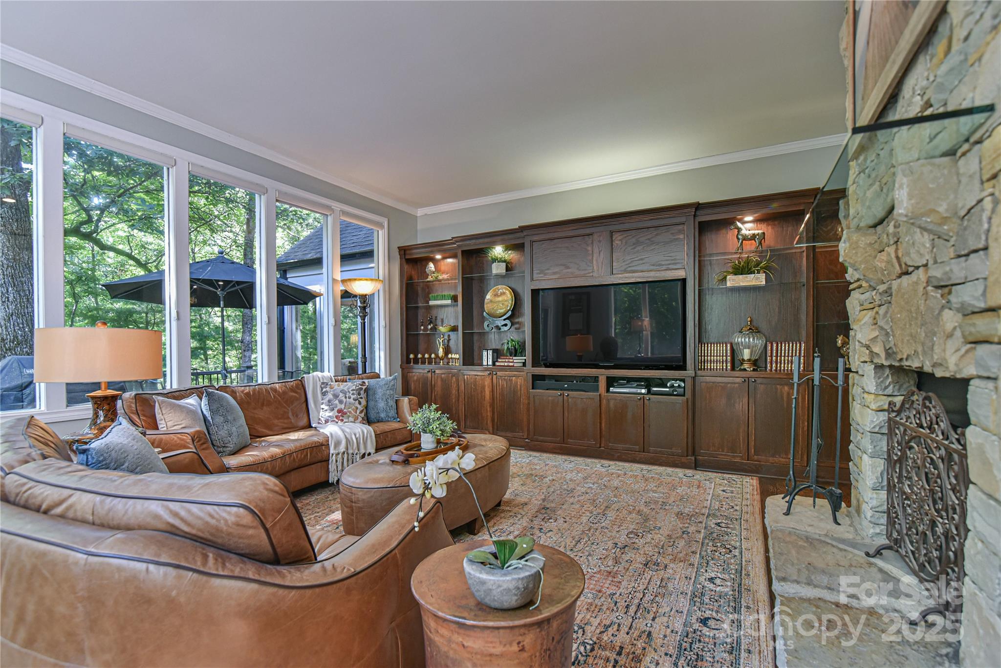 409 North Fork Road Black Mountain, NC 28711 - Photo 14 of 48 a living room with furniture and a flat screen tv