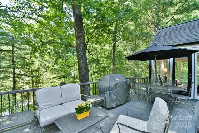 an outdoor sitting area with furniture and garden
