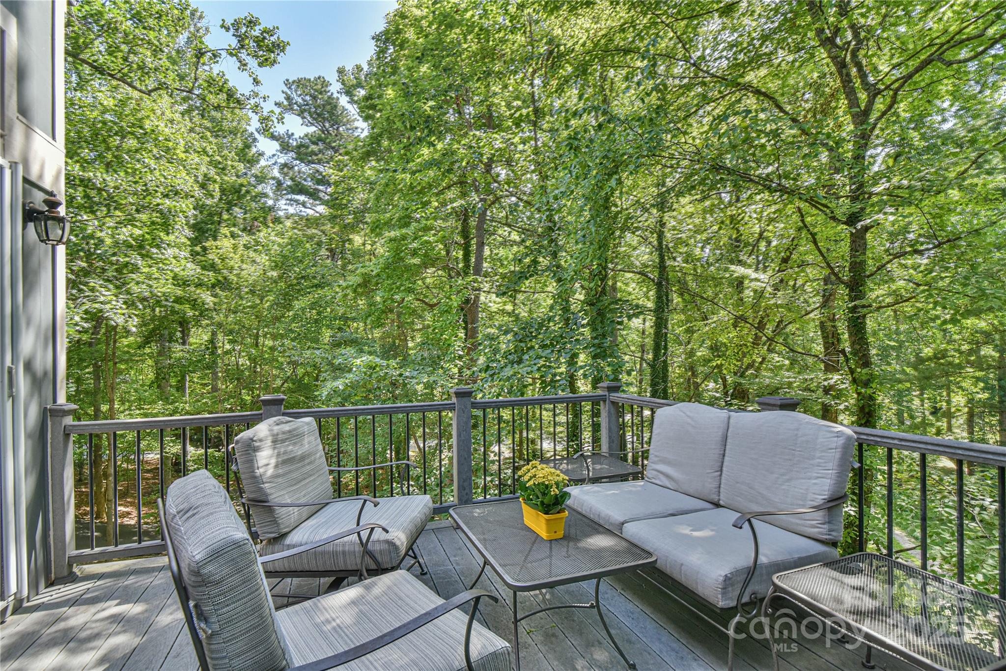 409 North Fork Road Black Mountain, NC 28711 - Photo 16 of 48 a balcony with wooden floor and outdoor seating
