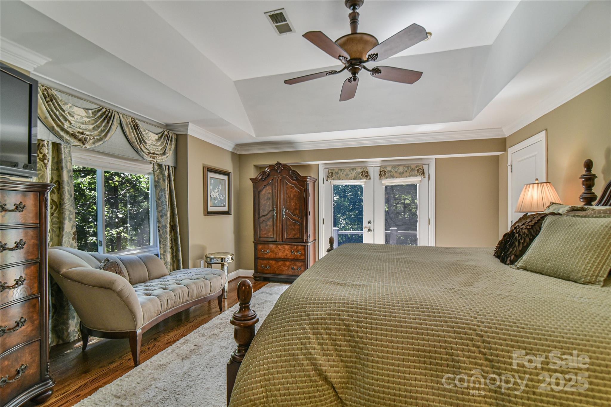 409 North Fork Road Black Mountain, NC 28711 - Photo 24 of 48 a bedroom with a large bed couch and windows
