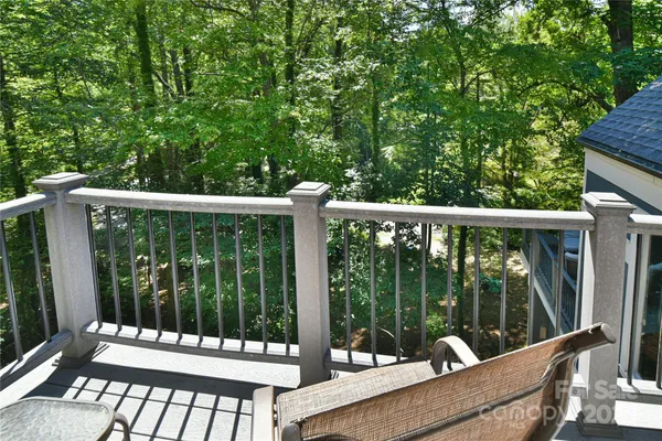 a view of a chair and table in the balcony