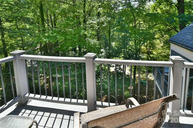 a view of a chair and table in the balcony