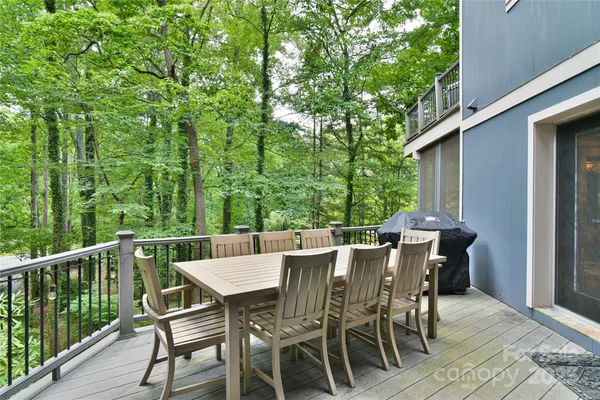 a view of a patio with a table and chairs