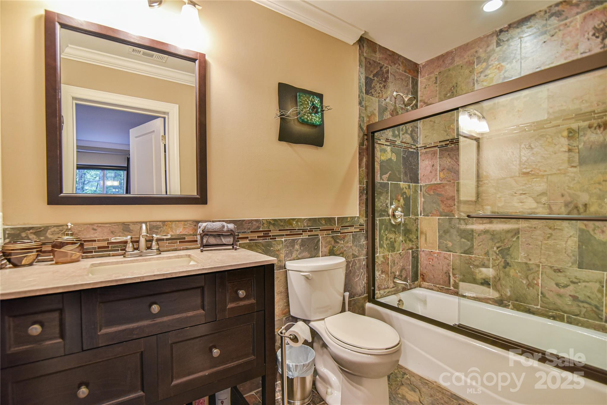 409 North Fork Road Black Mountain, NC 28711 - Photo 39 of 48 a bathroom with a toilet sink and mirror