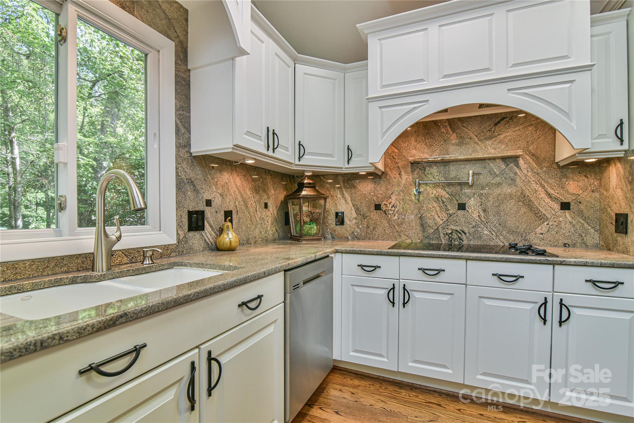 409 North Fork Road Black Mountain, NC 28711 - Photo 6 of 48 a view of granite countertop white cabinets and a sink