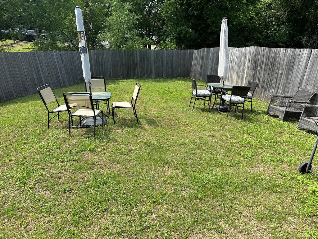701 Parkplace Ridge Princeton, TX 75407 - Photo 7 of 13 a backyard of a house with table and chairs