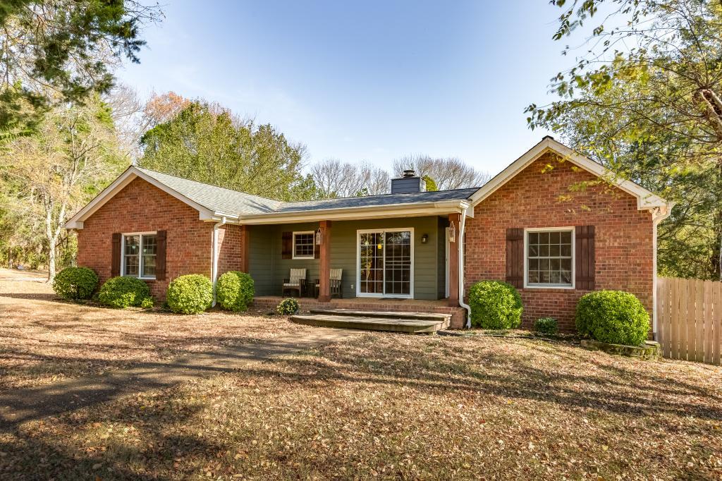 661 Beckwith Road Mount Juliet, TN 37122 - Photo 2 of 26 a front view of a house with a yard and potted plants