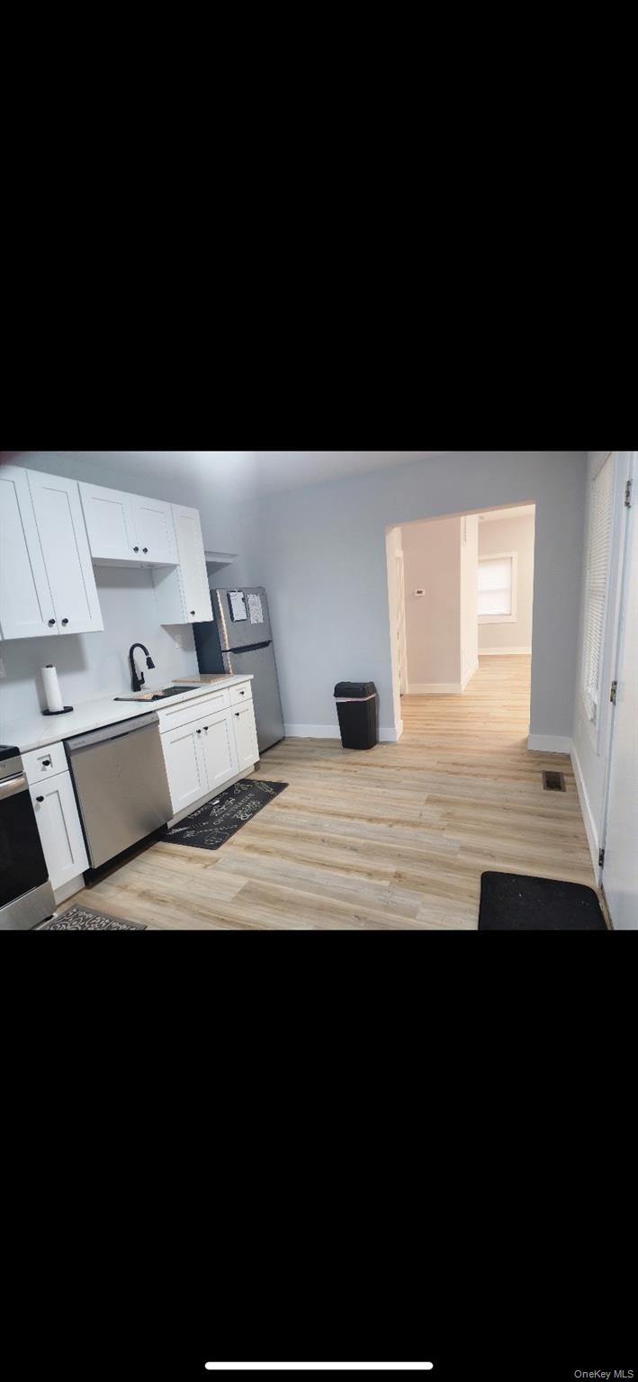 18 Carman Street, Unit 2 Patchogue, NY 11772 - Photo 8 of 11 a view of a room with furniture