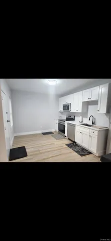 a view of a kitchen with a sink