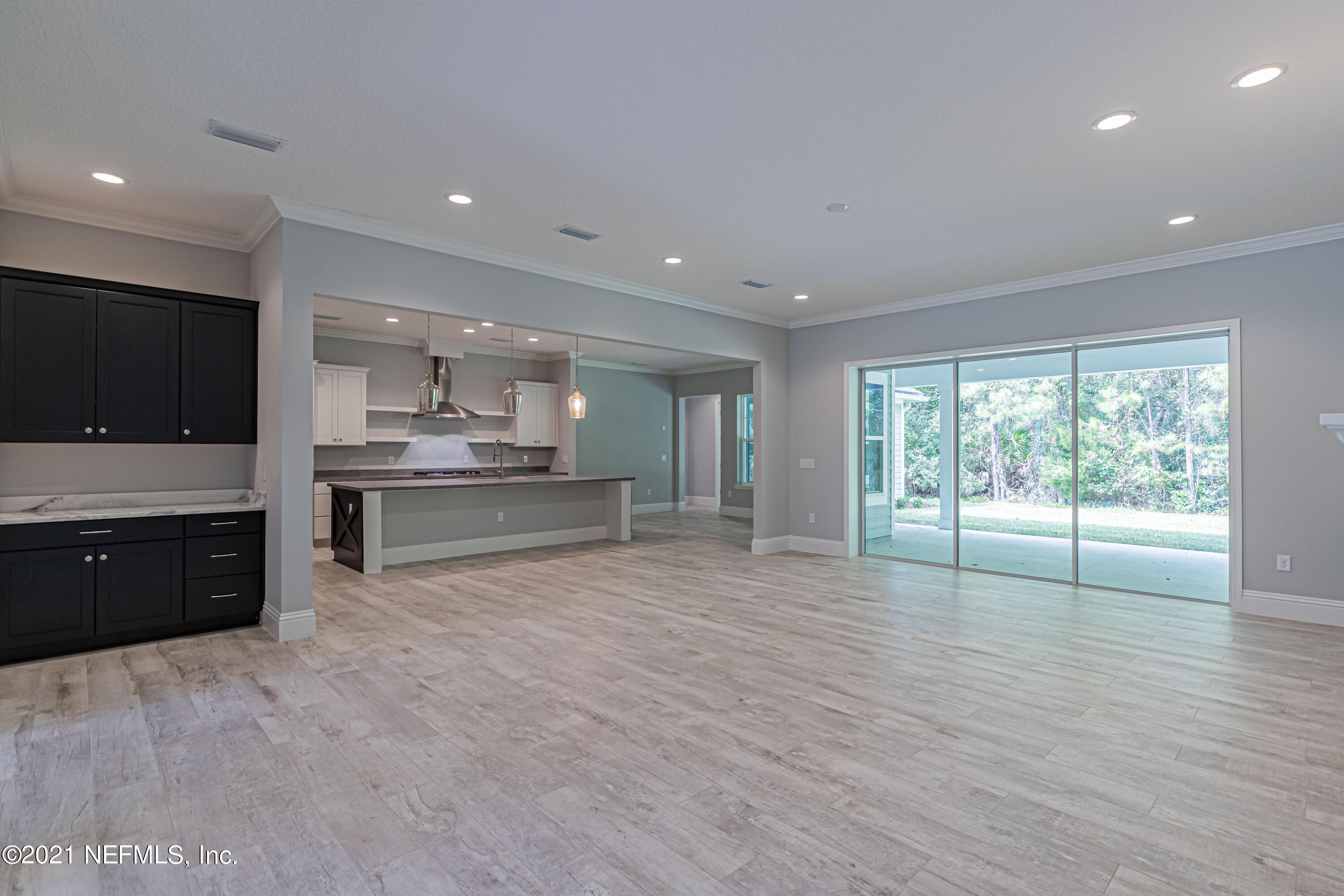 1351 Weaver Glen Road Jacksonville, FL 32223 - Photo 11 of 30 a large kitchen with stainless steel appliances granite countertop a large counter top and a wooden floors