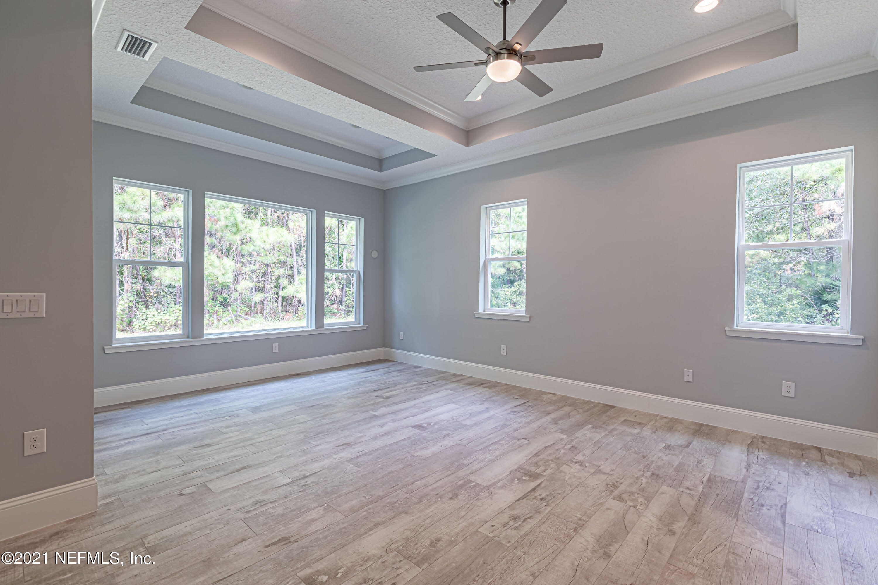 1351 Weaver Glen Road Jacksonville, FL 32223 - Photo 16 of 30 a view of an empty room with a window and wooden floor