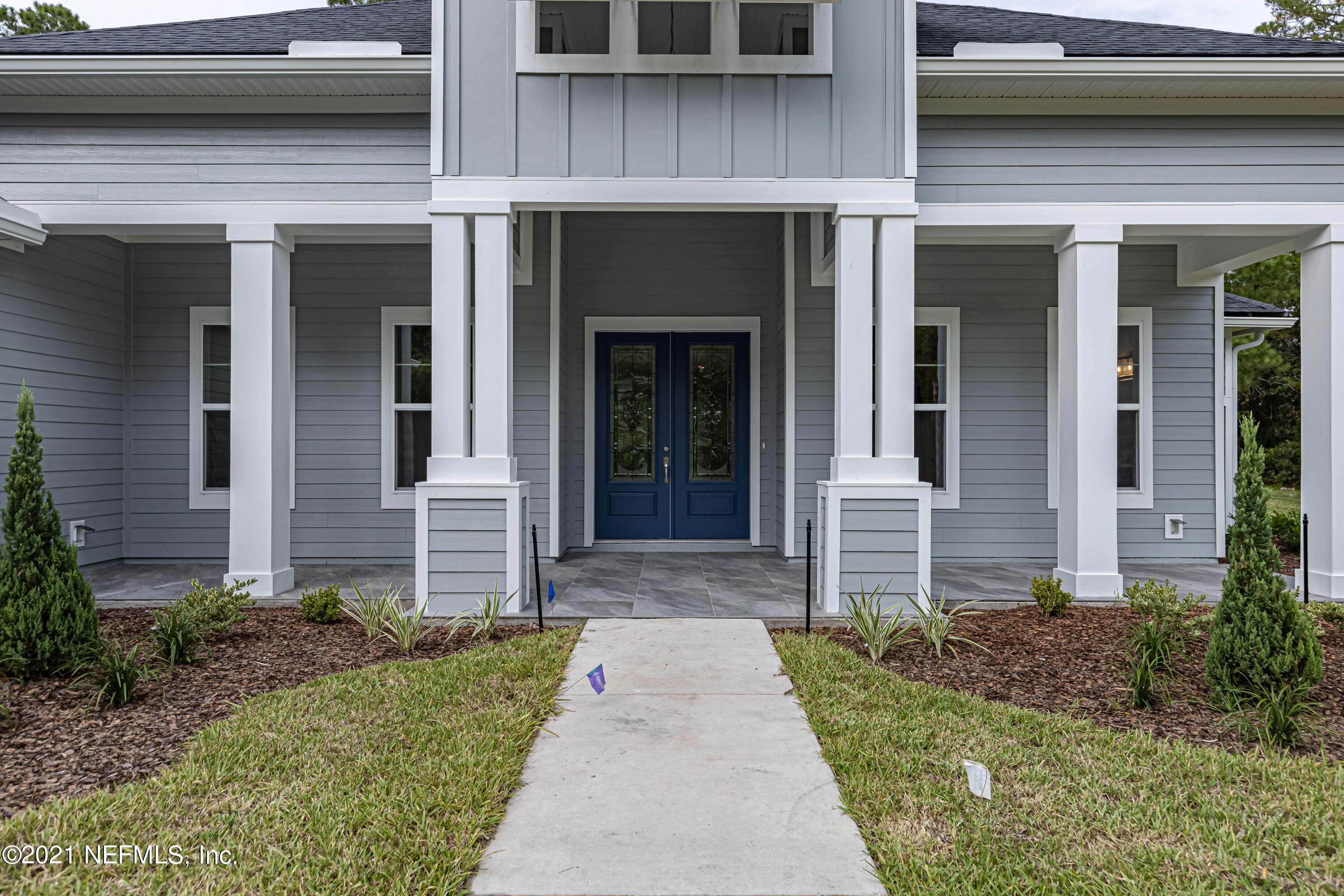 1351 Weaver Glen Road Jacksonville, FL 32223 - Photo 2 of 30 a front view of a house with a yard