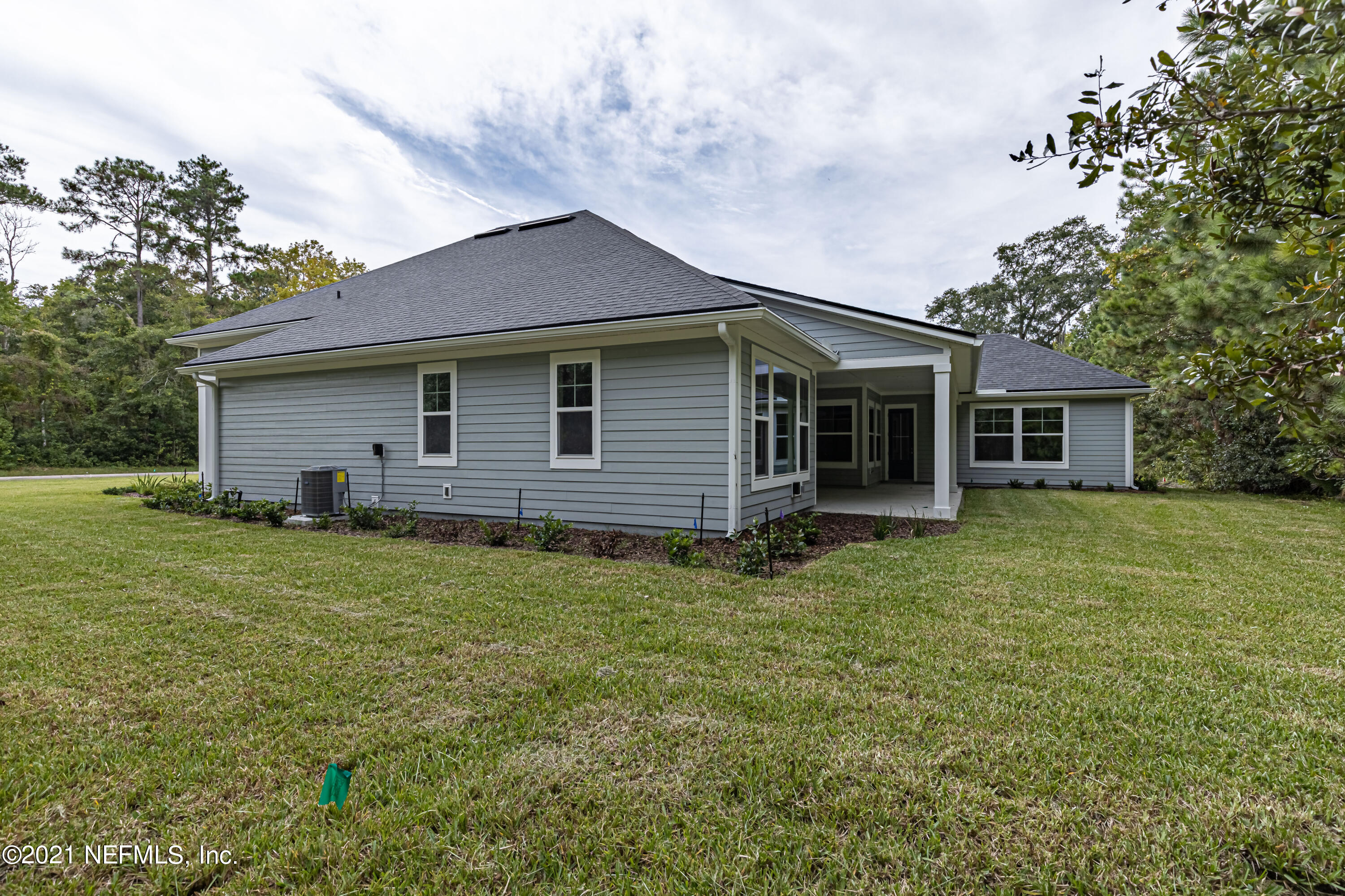 1351 Weaver Glen Road Jacksonville, FL 32223 - Photo 27 of 30 a backyard of a house with seating space