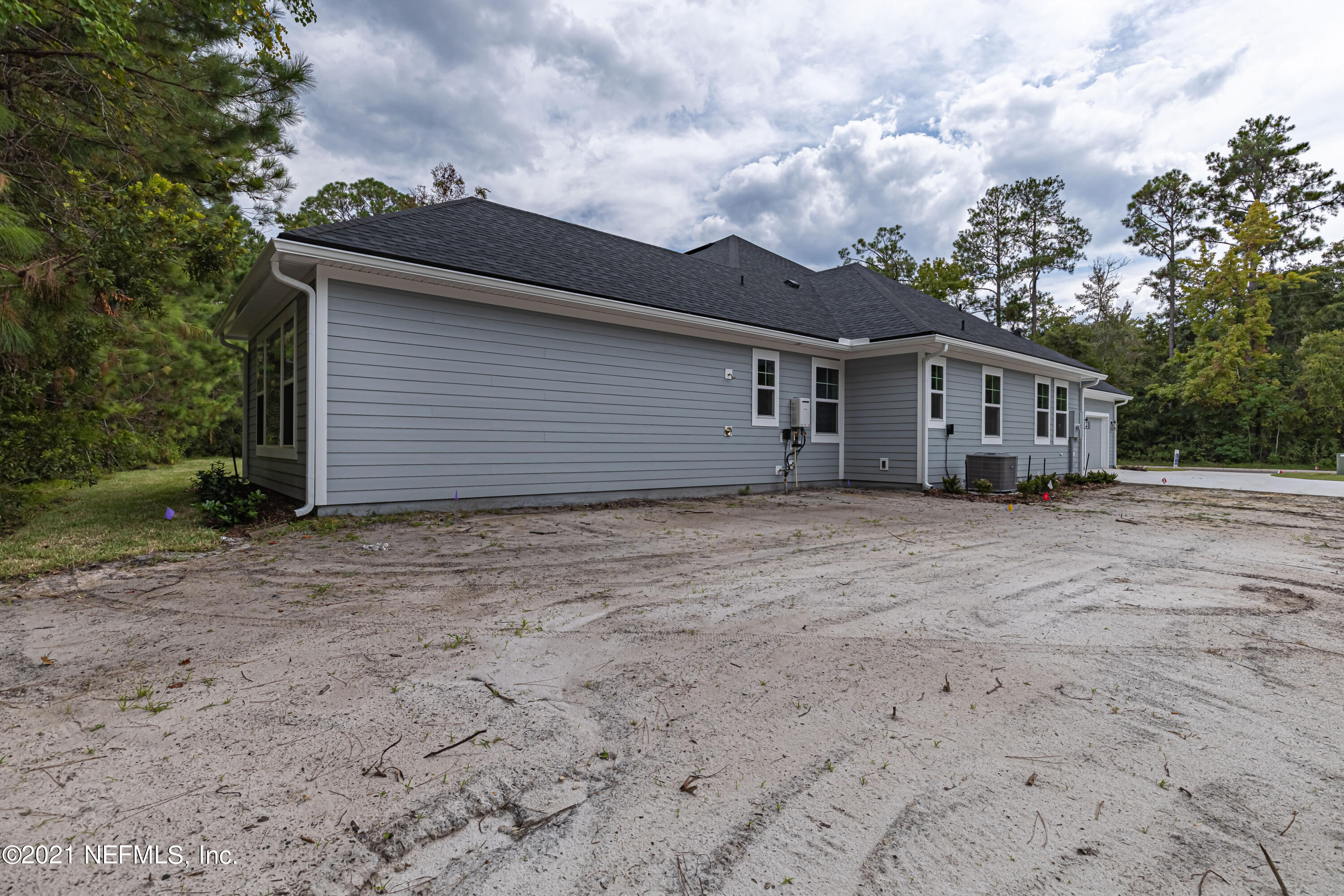 1351 Weaver Glen Road Jacksonville, FL 32223 - Photo 28 of 30 a view of a house with a backyard