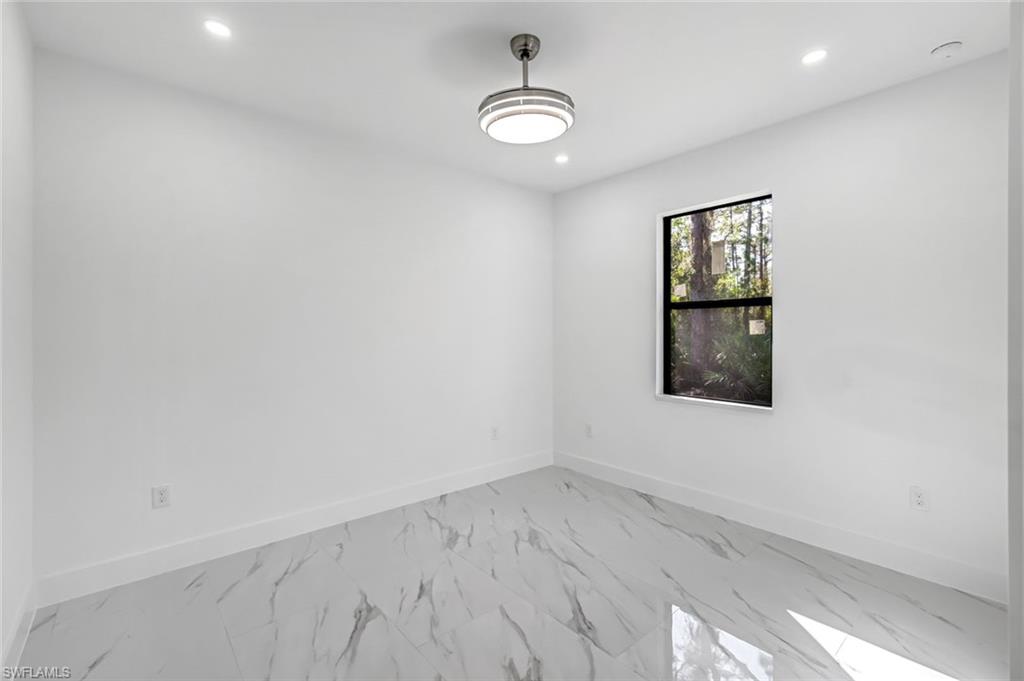 2113 Grayson Avenue Alva, FL 33920 - Photo 15 of 25 Unfurnished room featuring marble look tile flooring and recessed lighting