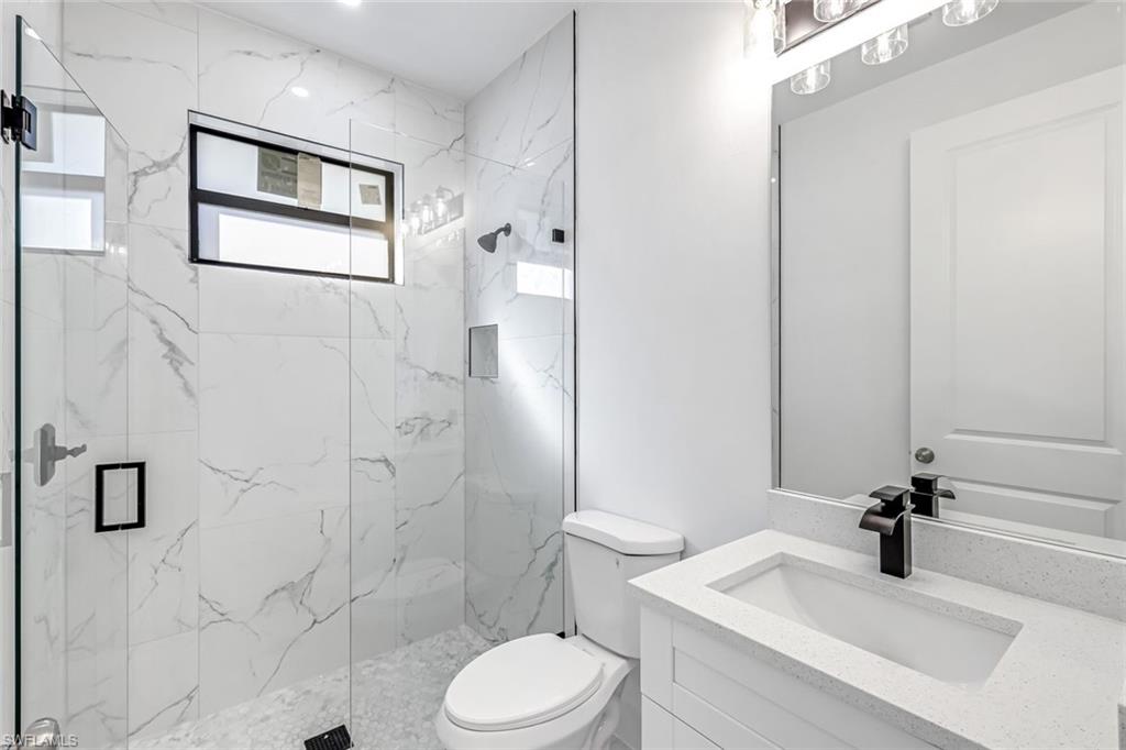 2113 Grayson Avenue Alva, FL 33920 - Photo 16 of 25 Bathroom featuring vanity and a marble finish shower