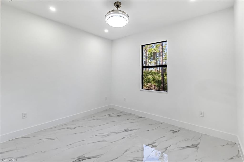 2113 Grayson Avenue Alva, FL 33920 - Photo 17 of 25 Spare room with light marble finish flooring and recessed lighting