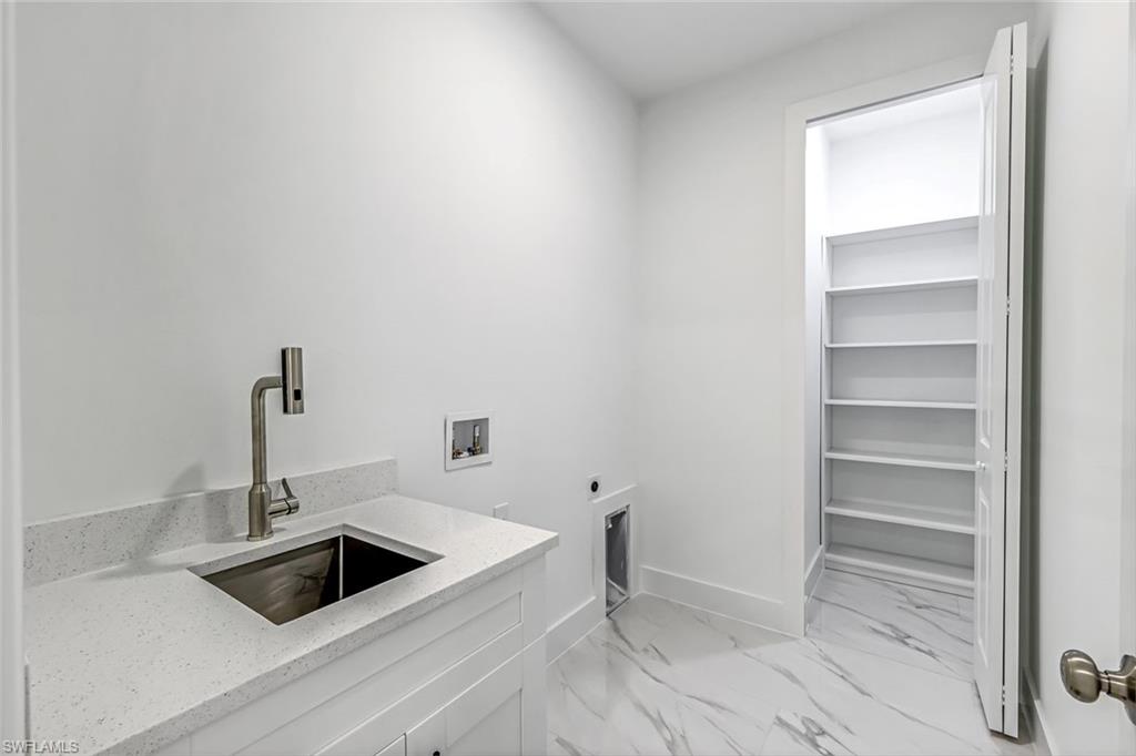 2113 Grayson Avenue Alva, FL 33920 - Photo 19 of 25 Laundry area with light marble finish flooring, hookup for an electric dryer, and hookup for a washing machine