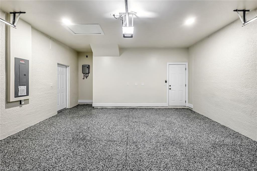 2113 Grayson Avenue Alva, FL 33920 - Photo 20 of 25 Garage featuring a textured wall and electric panel