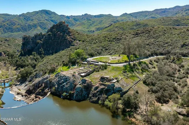 an aerial view of a house with mountain view