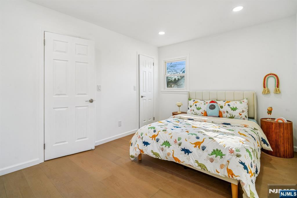 127 Village Circle West Paramus, NJ 07652 - Photo 15 of 46 a bedroom with a bed and a table