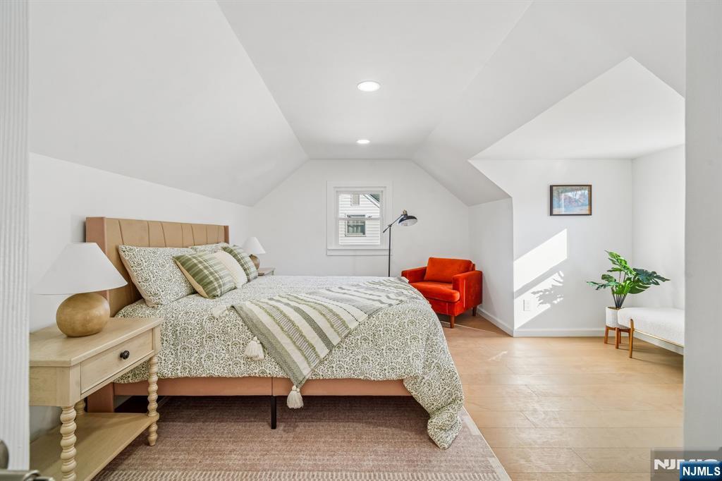 127 Village Circle West Paramus, NJ 07652 - Photo 16 of 46 a bedroom with a bed and window