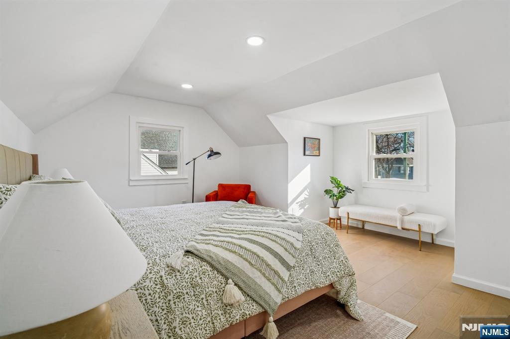 127 Village Circle West Paramus, NJ 07652 - Photo 17 of 46 a bedroom with a bed and a couch