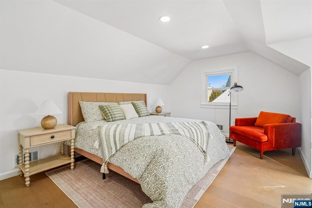 127 Village Circle West Paramus, NJ 07652 - Photo 18 of 46 a bedroom with a bed and a couch