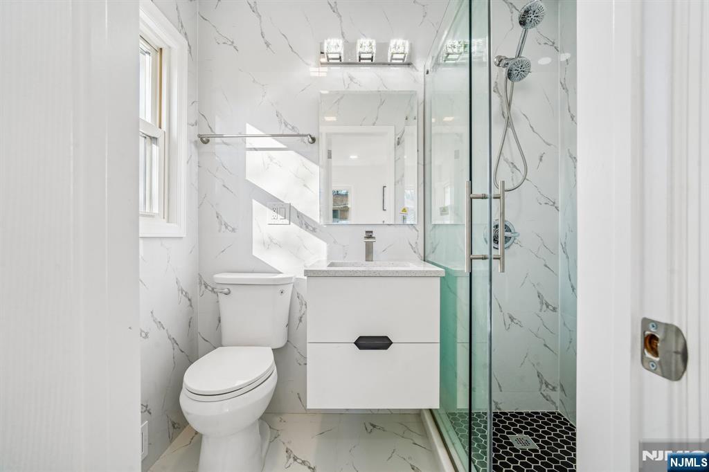 127 Village Circle West Paramus, NJ 07652 - Photo 26 of 46 a bathroom with a shower and a toilet