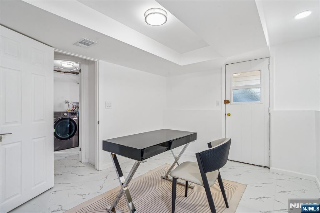 127 Village Circle West Paramus, NJ 07652 - Photo 29 of 46 a view of a room that has a couch and chairs in it