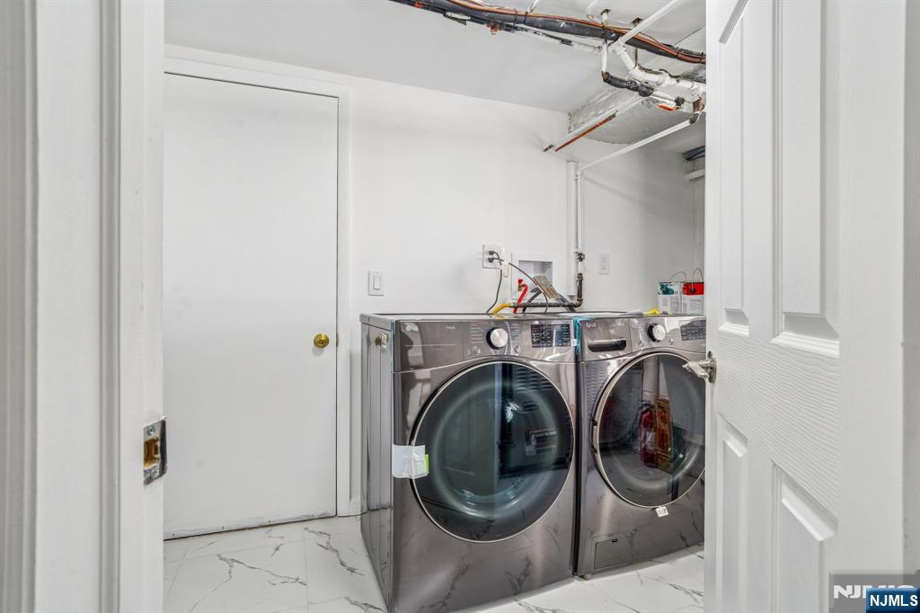 127 Village Circle West Paramus, NJ 07652 - Photo 30 of 46 a utility room with dryer and washer