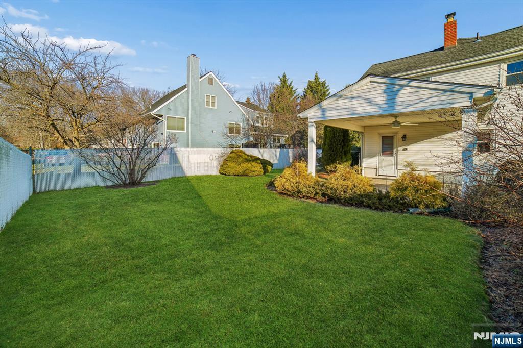 127 Village Circle West Paramus, NJ 07652 - Photo 36 of 46 a view of a house with a yard