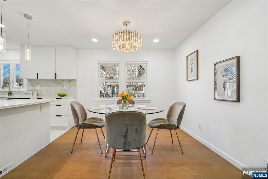 127 Village Circle West Paramus, NJ 07652 - Photo 9 of 46 a view of a dining room with furniture
