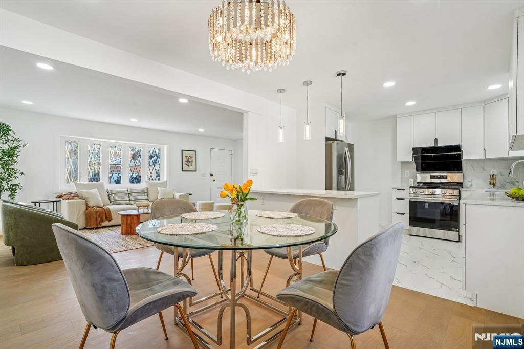 127 Village Circle West Paramus, NJ 07652 - Photo 10 of 46 a dining room with furniture and window