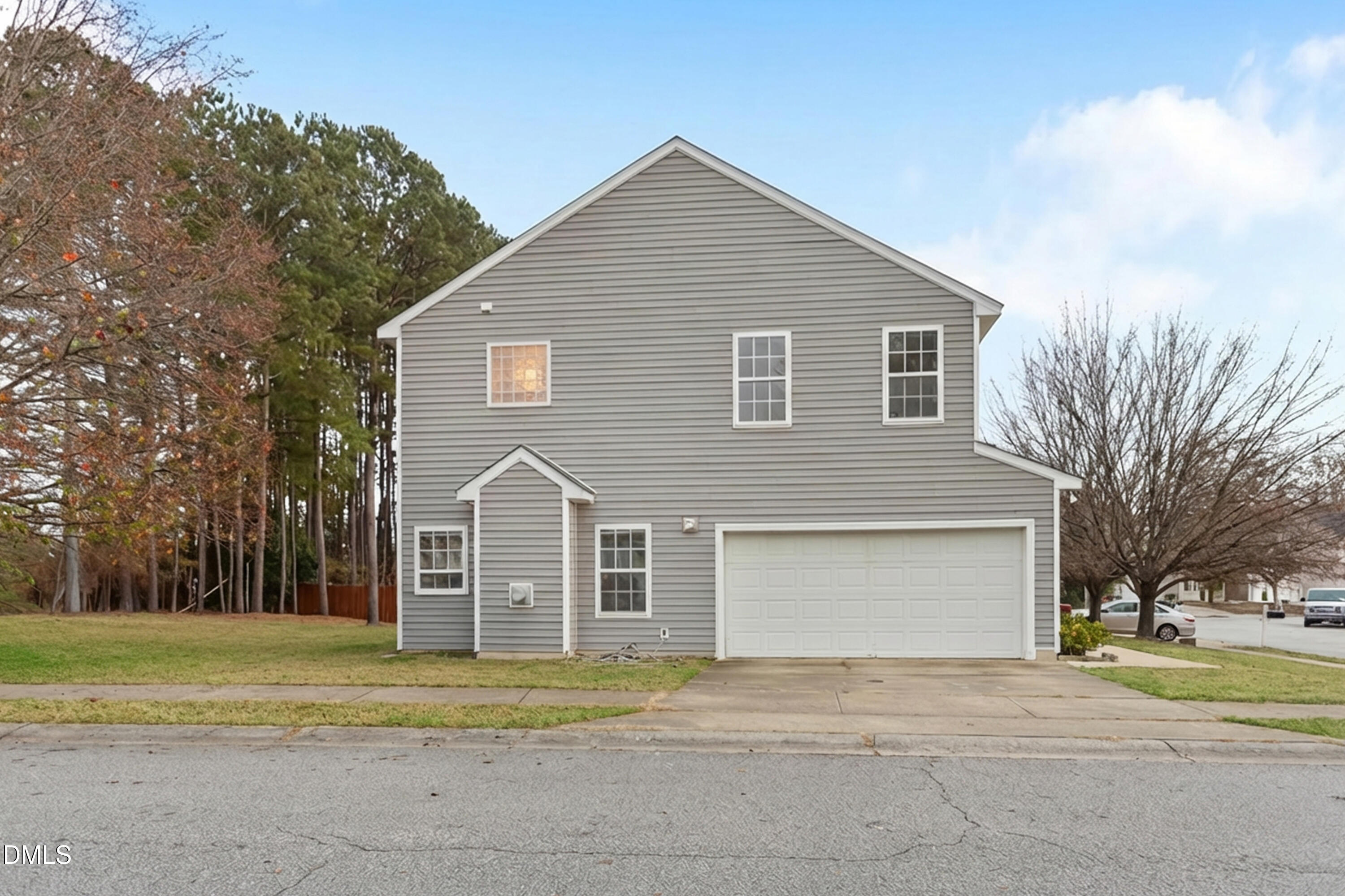 3101 Rendezvous Drive Raleigh, NC 27610 - Photo 7 of 39 a front view of a house with a yard and garage