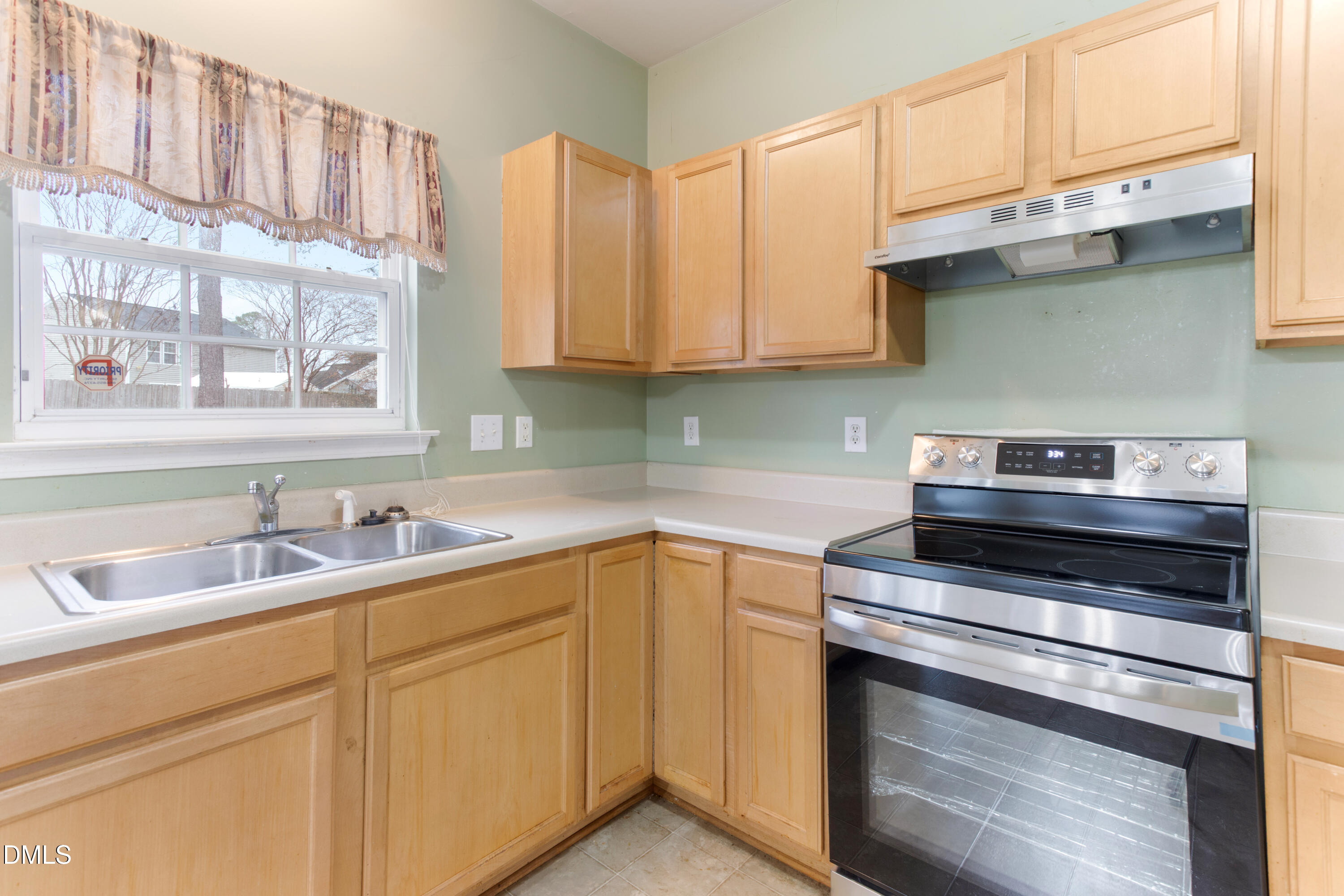 3101 Rendezvous Drive Raleigh, NC 27610 - Photo 10 of 39 a kitchen with appliances a sink and cabinets