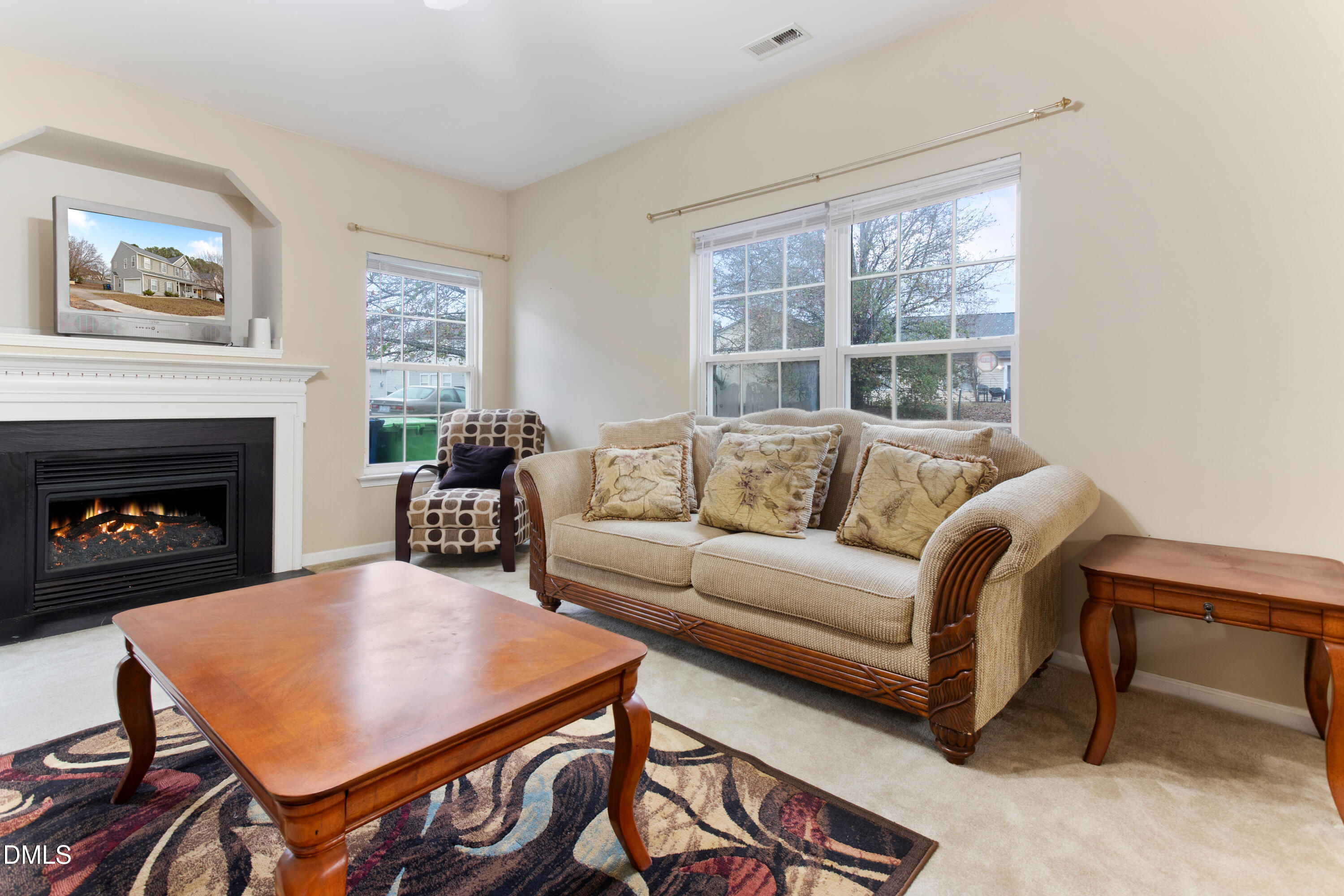 3101 Rendezvous Drive Raleigh, NC 27610 - Photo 12 of 39 a living room with furniture a table and a large window