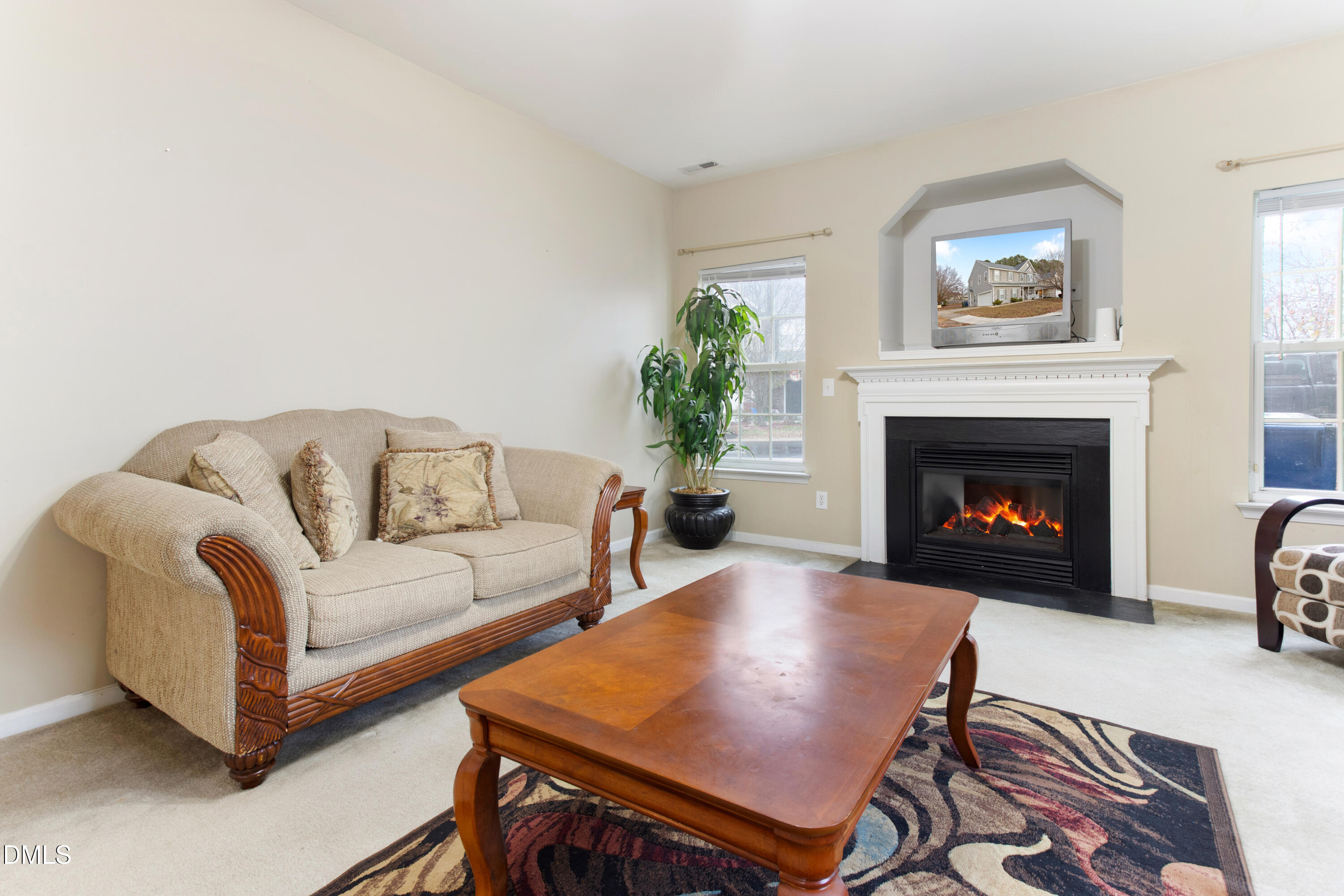 3101 Rendezvous Drive Raleigh, NC 27610 - Photo 13 of 39 a living room with furniture and a fireplace